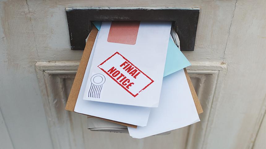 Uncollected post in a letterbox
