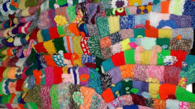 A collection of 50 knitted cannula sleeves