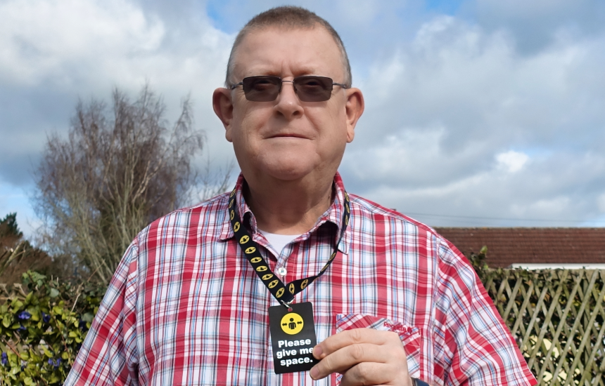 Peter Middleton wearing a Please give me space lanyard