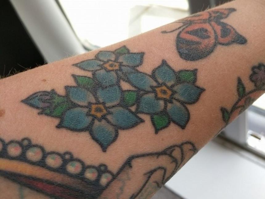 Sam Ronson's forget-me-not tattoo